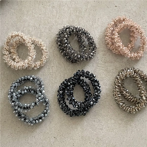 Set di 6 elastici per capelli in perline di cristallo colorate nei toni champagne e rosa