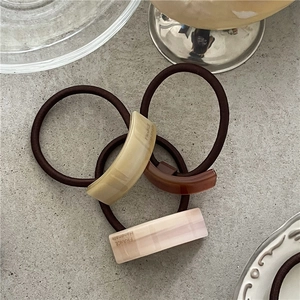 Three-piece set of elegant geometric acetate ponytail holders in neutral tones