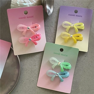 Lot de barrettes nœuds colorées avec dégradé et strass en rose jaune et bleu clair