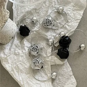 Silver mirror ball hair tie with metallic roses and beads for stylish ponytail styling
