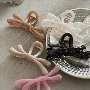 Five translucent jelly-like colorful butterfly bow hair claws in various summer colors