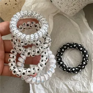 Polka dot and floral spiral telephone wire hair ties set for women in black and white