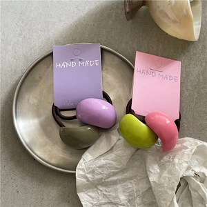 Two-piece colorful semi-circular resin ponytail holders set on handmade paper cards