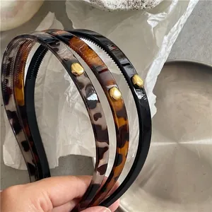 Three-piece set of leopard tortoise and black headbands with golden alloy accents