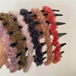 Colorful plush headbands with teeth in six shades including purple and orange for women