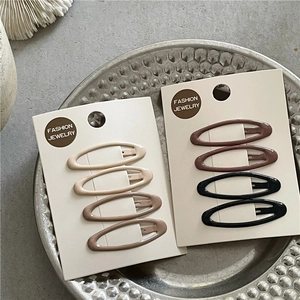 Eight minimalist matte finish BB hair clips in neutral earth tones on display cards