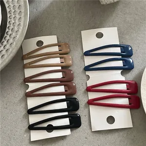 Set di 10 mollette a goccia minimaliste in cinque colori scuri su scheda display