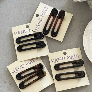 Set of eight hollow leopard print and solid color hair clips on display cards