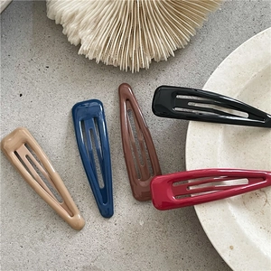 Set di cinque fermagli per capelli a goccia in colori scuri su pietra