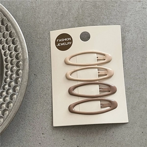Set of four leopard print oval BB hair clips in earthy gradient shades on white card