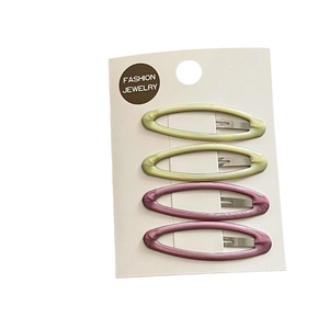Set of 4 oval leopard print hair clips in yellow and pink on a white jewelry display card