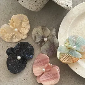 Elegant acetate orchid hair clip set with marble texture and faux pearl detail