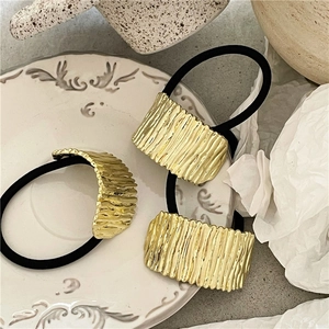 Three-piece set of vintage gold wavy alloy hair rings with black elastic ropes