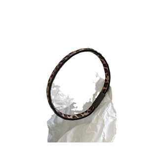 Fashionable leopard print elastic hair scrunchie with durable metallic fastener on white background