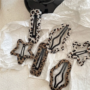 6-piece leopard print hair clip set with rectangle, star, and wave shapes on white paper