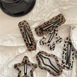 Retro leopard print hair clips set with star and rectangle shapes on white background
