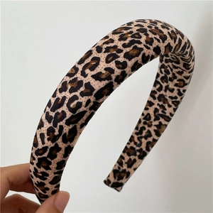 Close-up of leopard print padded headband with soft vintage fabric texture details