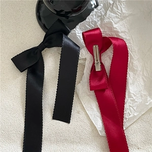 Elegant long silk ribbon bow hair clips in black and wine red with jagged edges