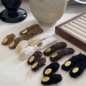 Retro plush fabric geometric hair clips set in brown and cream with gold metal detail
