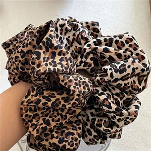 Oversized leopard print scrunchie for women with stylish cheetah pattern and soft fabric