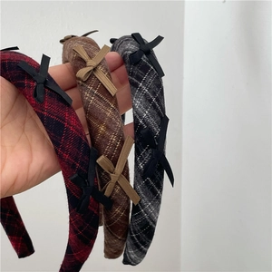 Three-piece set of padded plaid headbands with small bow accents for autumn winter
