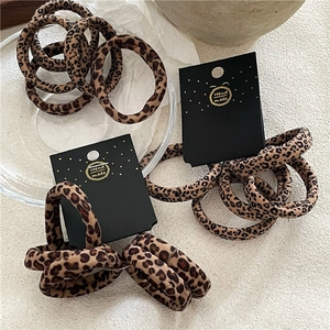 5-piece set of leopard print elastic hair scrunchies on handmade display cards