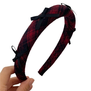 Padded red and black plaid headband with cute black ribbon bows in preppy style