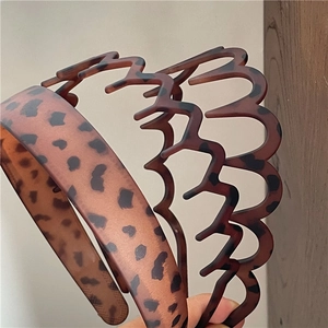 Detail of leopard print headbands set showing various wave shapes and resin textures