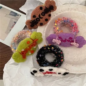 Cute handmade wool felt candy hair ties in various colors for girls' ponytails