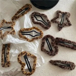 Assorted leopard print plush hair clips in heart, star, and drop shapes for women