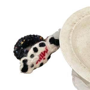 Handmade wool felt hair clip with colorful crochet ring and Milly embroidery design