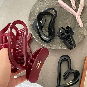 Elegant matte hair claw clips set in burgundy black and pink with heart design