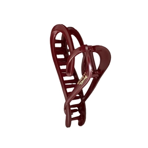 Elegant wine red heart-shaped hair claw clip with golden lettering and hollow design