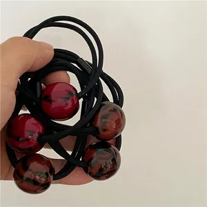 Set of 5 black elastic hair ties with vintage leopard print polished round beads