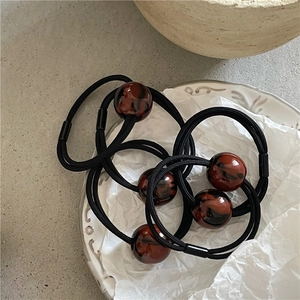 Three-piece set of black elastic hair ties with leopard print marble resin beads