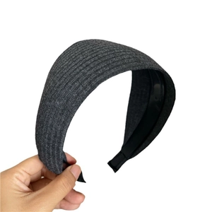 Gray knitted wide headband with vertical ribbed texture and non-slip black inner teeth