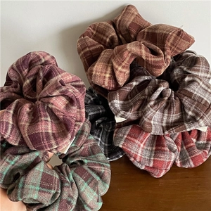 Classic checkered fabric scrunchies set in various vintage plaid patterns and colors
