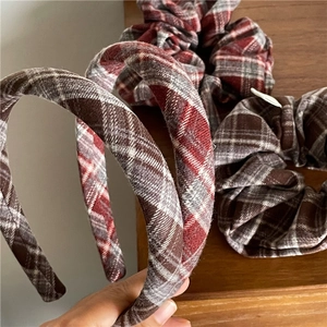 Detail view of red plaid headband set and matching scrunchies with soft cotton fabric