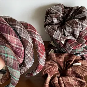 Classic plaid fabric headband and scrunchies set with vintage argyle pattern on wood background