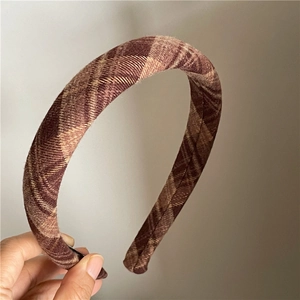 Close-up of retro brown plaid headband featuring premium textured fabric and neat edges
