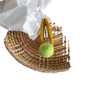 V-shaped yellow felt hair clip with green pompom detail for women and girls