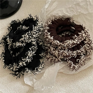 Knitted scrunchies with fringe trim in black and coffee brown for autumn styling