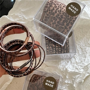 Set di 8 elastici per capelli con stampa leopardata in scatola per lo styling quotidiano