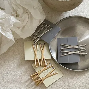 Set di fermagli per capelli minimalisti a forma di X in metallo spazzolato oro e argento
