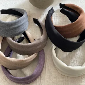 Wide sponge padded headbands in various Morandi colors with soft textured fabric