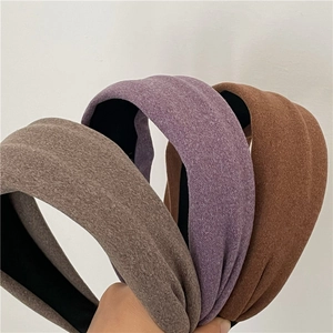 Detailed comparison of wide sponge headbands in brown, purple and brick red fabric