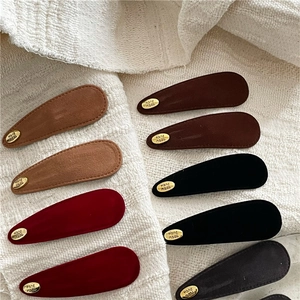 Retro suede teardrop snap hair clips in assorted autumn colors with handmade metal tag