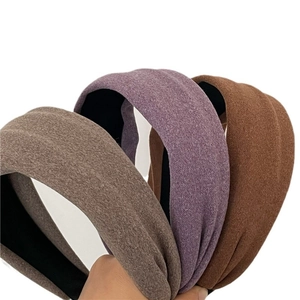 Three-piece set of wide padded velvet headbands in brown, purple, and gray colors