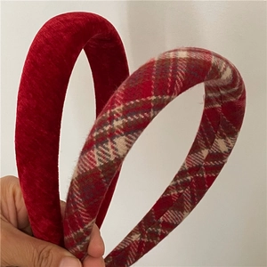 Detailed view of thick red velvet and checkered sponge padded headbands for women
