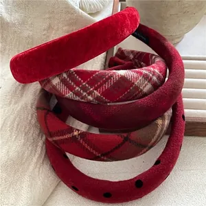 Thick red wide-brimmed padded headbands with plaid, polka dot, and velvet textures